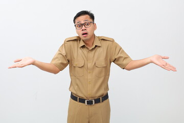 Confused Indonesian civil servant man standing with asking something gesture