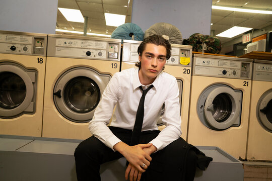 Business man in a laundromat 