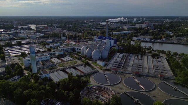 sewage treatment plant, circular clarifiers. Stunning aerial view flight drone