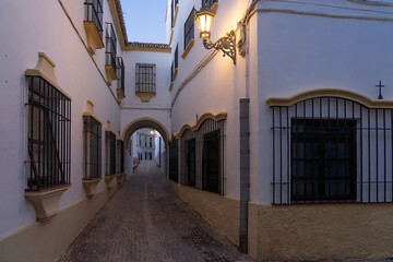 Beautiful street in the old town of the city of Ronda at night. Malaga, Andalucia, Spain.