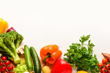 Different fresh vegetables and parsley on white background