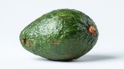A Perfectly Ripe Green Avocado Isolated on a White Background