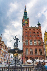 Naklejka premium Neptune's Fountain in front of the Main City Hall at the Long Market Square in Gdansk, Poland
