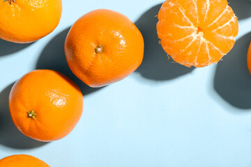 Sweet mandarins on blue background