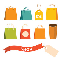 Collection of colorful shopping bags and tags with a shop ribbon