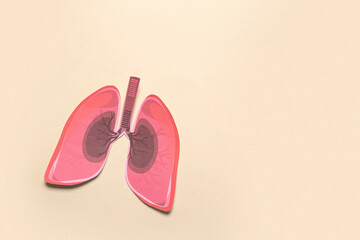 Paper lungs on beige background