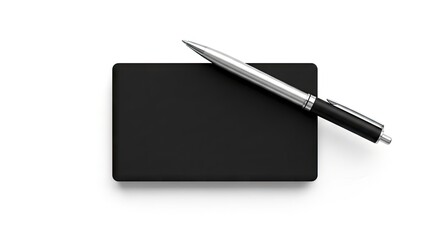 A silverblack pen rests atop a rectangular black notepad set against a white backdrop