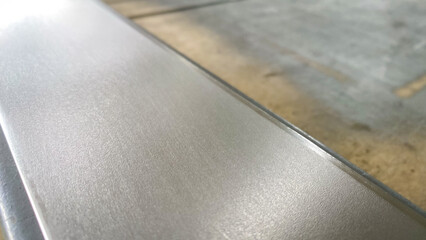 Stack of stainless steel flat bar of background. 