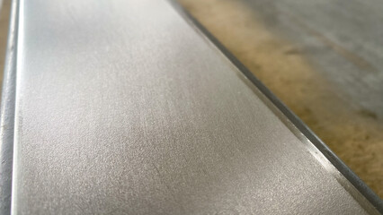 Stack of stainless steel flat bar of background. 