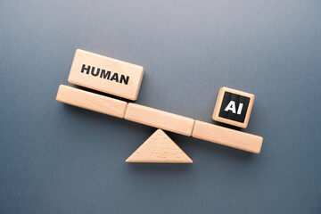 Wooden blocks on a seesaw showing human outweighing AI, symbolizing comparison between human...