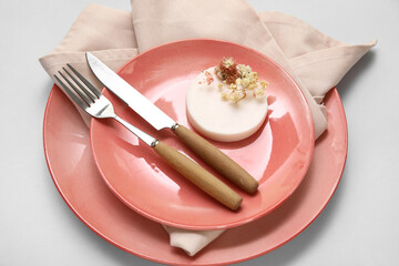 Stylish table setting with beautiful flowers on grey background