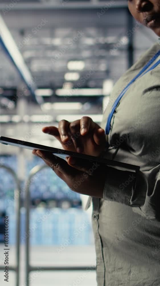 Poster vertical video data center programmers check ai dashboard using tablet, doing systems review. server