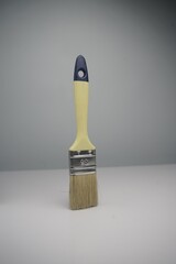 New paint brush with yellow handle and natural bristles, perfect for painting, DIY, and home...