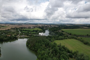 Large suspended bridge and main road over Jordan reservoir in Tabor aerial view