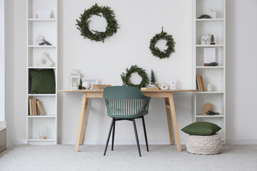 Light interior of room with table and winter decor