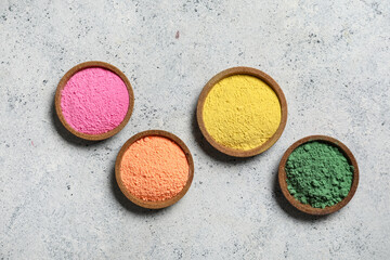 Bowls of powder pigment on grunge background
