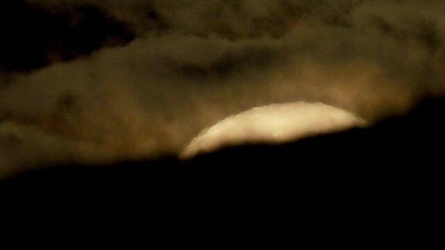 Tokyo, Japan - August 8, 2025: Setting moon on the edge of mountain