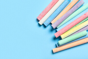 Obraz premium Colorful chalks on blue background