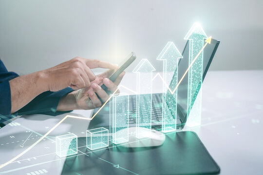chart, diagram, graph, invest, investor, management, statistic, risk, analyzing. A man is typing on a laptop with a graph of a stock market on the screen.business growth concept.