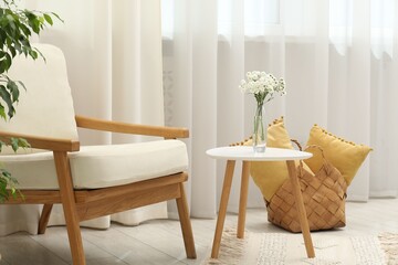 Stylish furniture near window with curtains in living room. Interior design