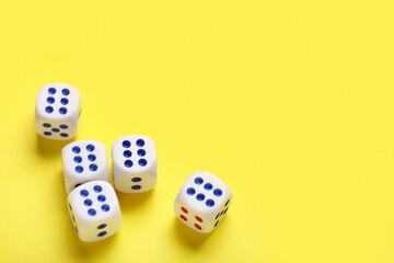 Dices with red and blue pips on yellow background