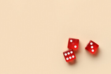 Red dices on beige background