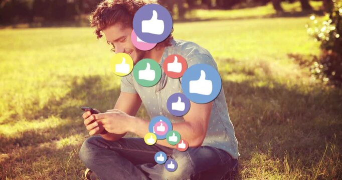 Male sitting on lawn scrolling phone activating floating social media thumbs-up icons around torso