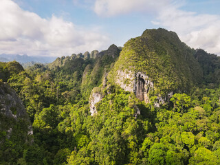 The beauty of the Sangkulirang Mangkalihat karst cliffs is surrounded by tropical rainforest in the...