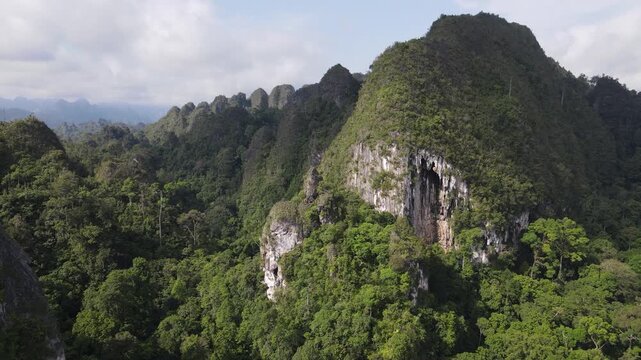 The beauty of the Sangkulirang Mangkalihat karst cliffs is surrounded by tropical rainforest in the Merabu ecotourism area, Berau Regency and East Kutai Regency, East Kalimantan, Indonesia.