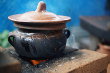 Traditional Guatemalan Mayan chocolate making with cacao beans, comal plate and metate