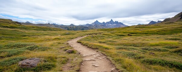 Mountain trail landscape with hiking path and cloudy sky scenic view