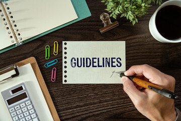 There is a piece of paper with the word Guidelines. It is as an eye-catching image.