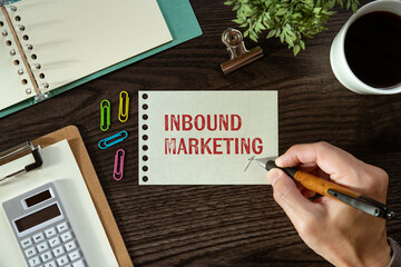 There is a piece of paper with the word Inbound Marketing. It is as an eye-catching image.