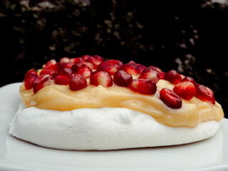 pavlova dessert with pomegranate on top