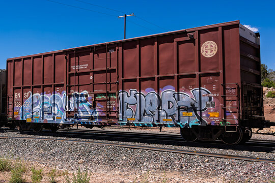 Cosnino Crossing 8-2-2025 Flagstaff, AZ USARail car painted with graffiti BNSF Railway West bound freight train on the BNSF Seligman Sub East of Flagstaff Arizona