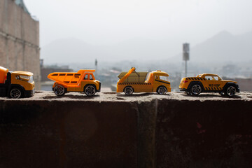 Yellow taxi cab driving through urban traffic on a busy city street. Classic transportation scene with cars, bus, truck, and auto vehicles in motion in New York.