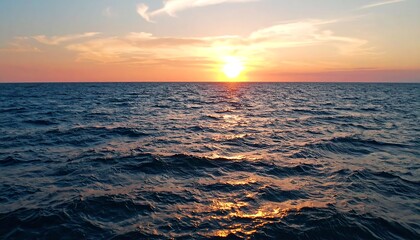 Obraz premium Sunset over calm water