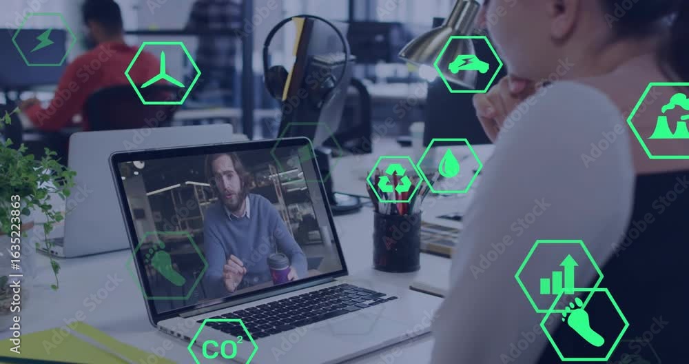 Poster office worker watching colleague gesturing on laptop while icons fading in showing eco metrics