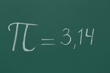 Number Pi drawn on green chalkboard