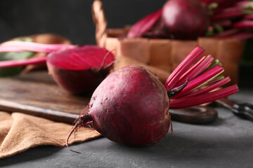 Fresh baby beetroots on black background