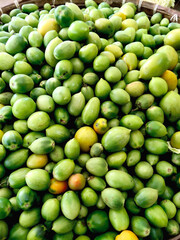A Large Pile of Green Tomatoes