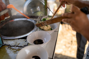 Indonesian Chicken Noodles Sold from Street GrobakIndonesian Chicken Noodles Sold from Grobak Cart