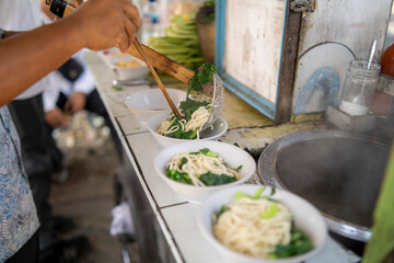 Indonesian Chicken Noodles Sold from Grobak Cart