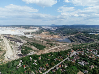 The abandoned, dead city near the Kolubara pit on coal mining by the open way. Drone view...