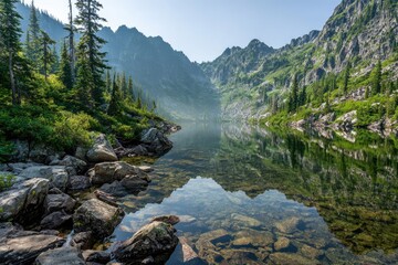 Serene mountain lake reflecting a misty morning sky