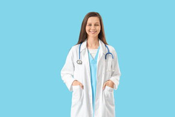 Female medical intern on blue background