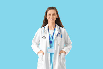 Female medical intern on blue background