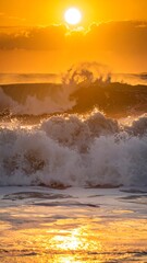 Fototapeta premium Golden sunrise over turbulent ocean waves