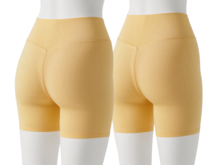 Comfortable golden spandex cycling shorts for active women on mannequins against isolated