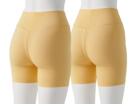 Comfortable golden spandex cycling shorts for active women on mannequins against isolated